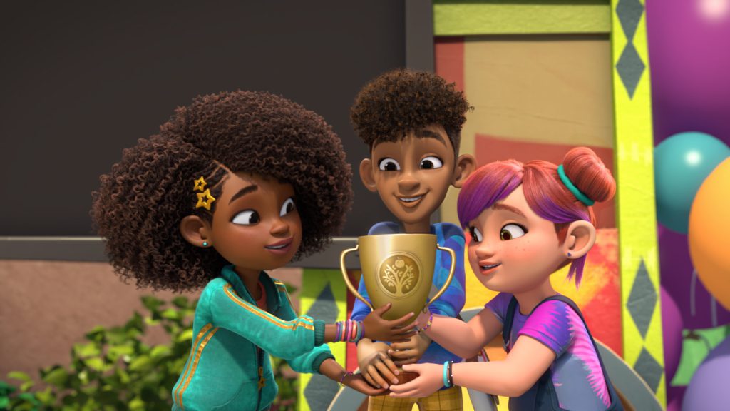 Karma, Switch, and Winston holding a gold trophy together