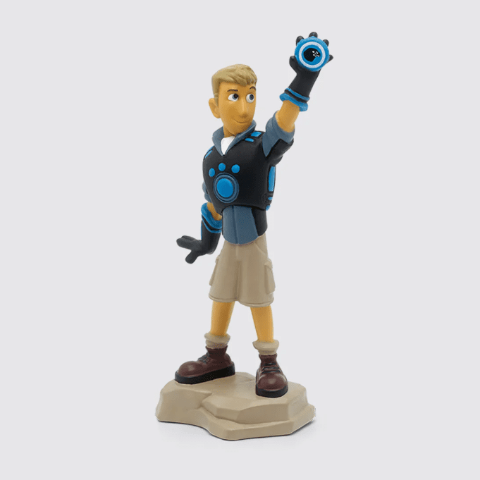 A blonde figurine wearing a tactical vest and cargo shorts, waving